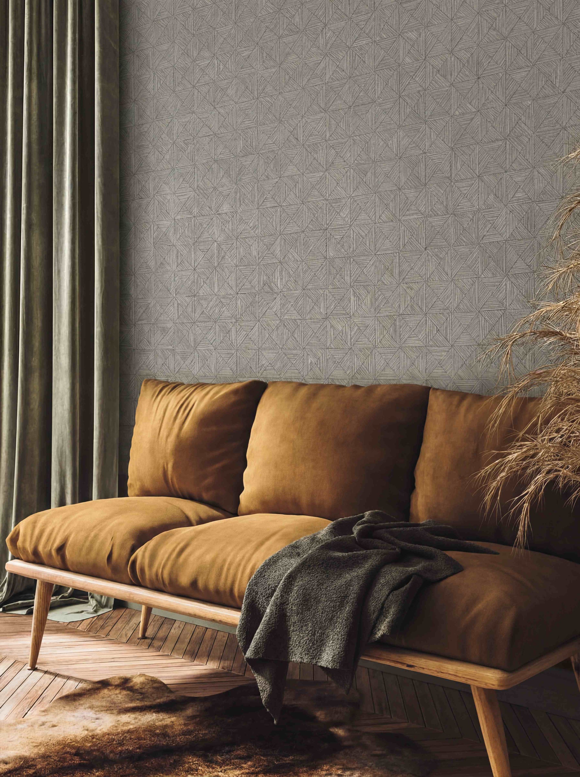 Cozy living room with a brown velvet sofa, green curtains, and textured gray Inlay Tile Wallpaper on the wall.