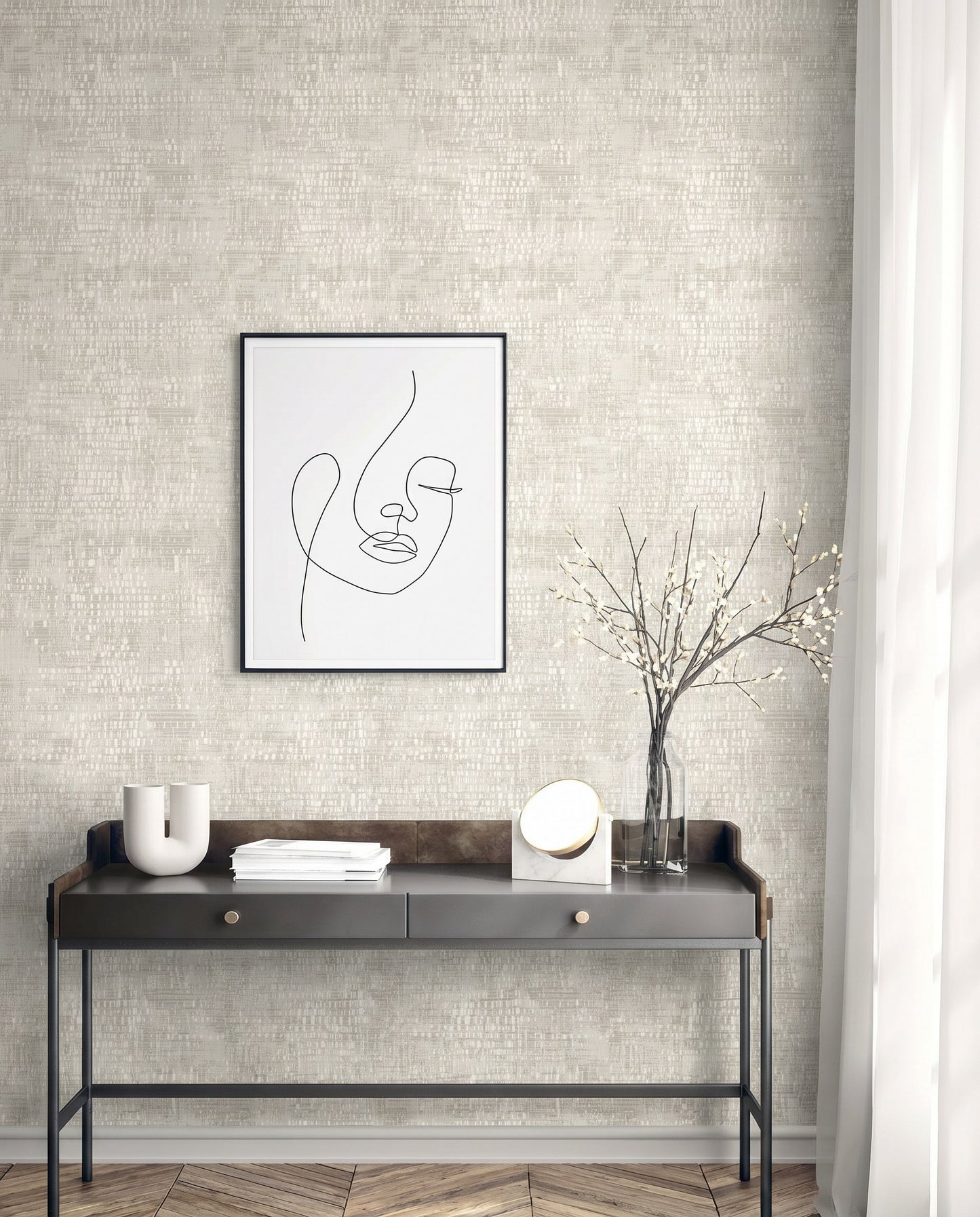 Minimalist desk with decor and vase of branches beneath abstract line art on Dotted Wallpaper.