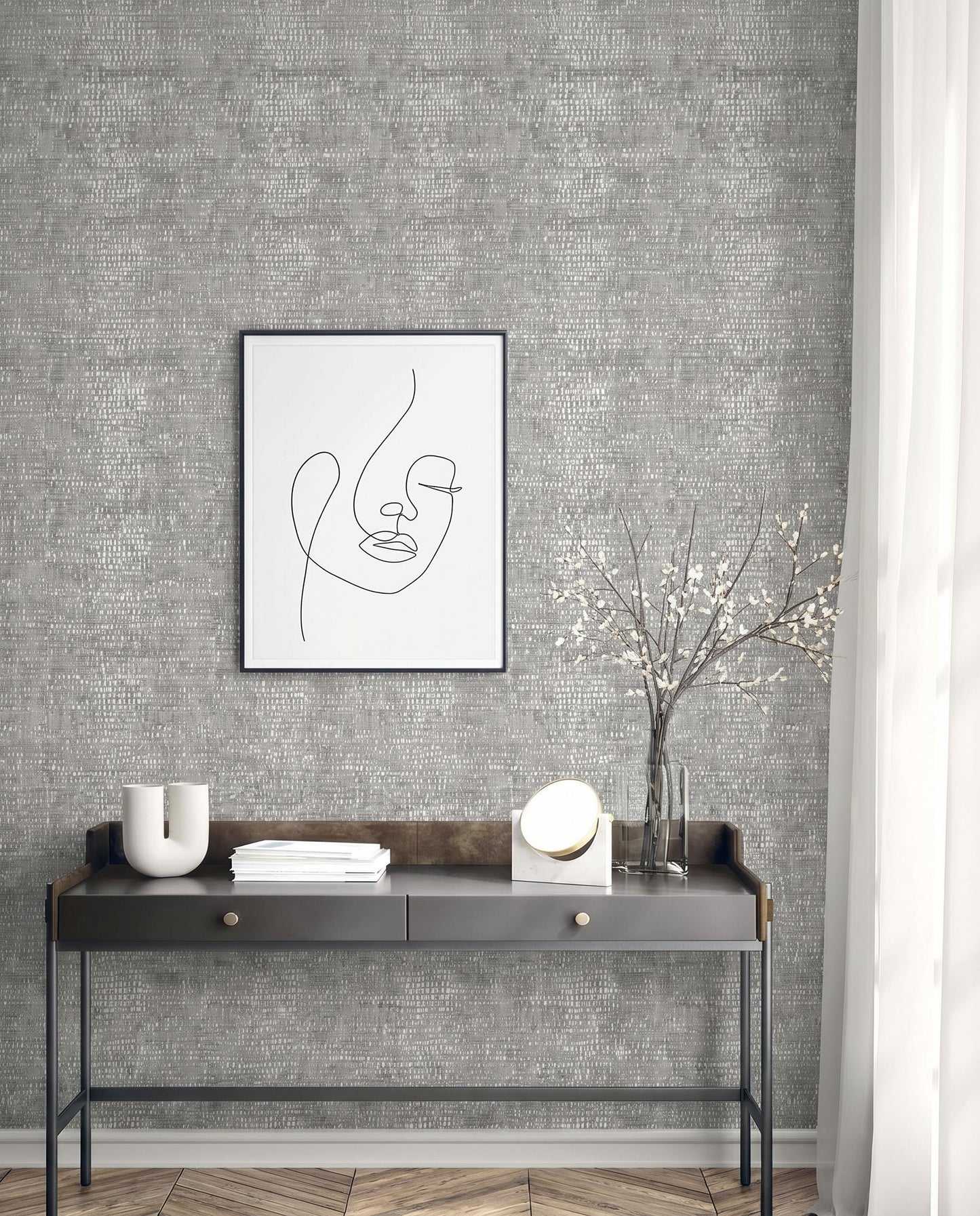 Minimalist entryway with a black console table, abstract line art, Dotted Wallpaper, white vase, books, and branches.