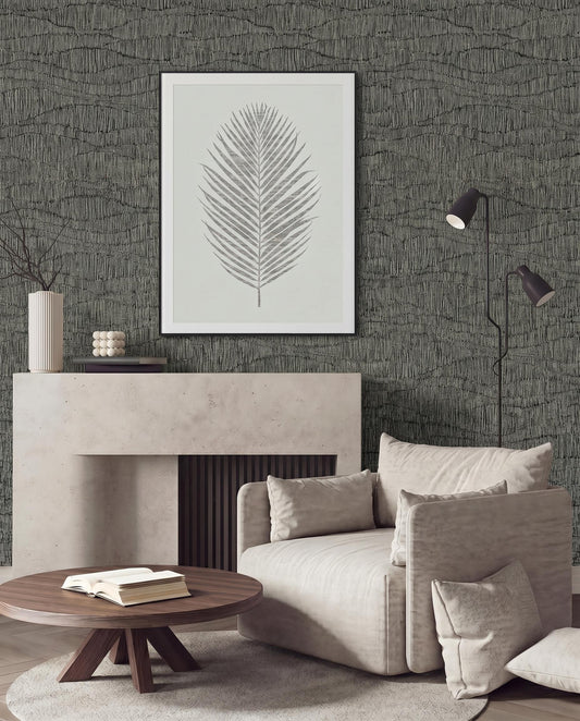Modern living room with Wavy Wallpaper, a framed leaf print, beige armchair, round table, and floor lamp.