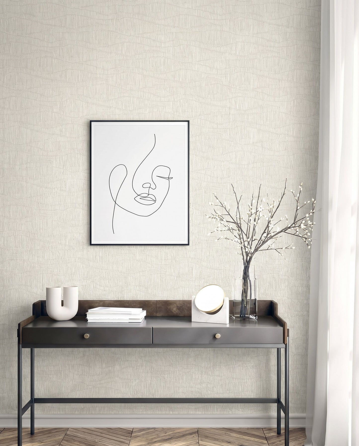 Minimalist desk with vases, books, mirror, and art on Wavy Wallpaper featuring a line-drawn face.