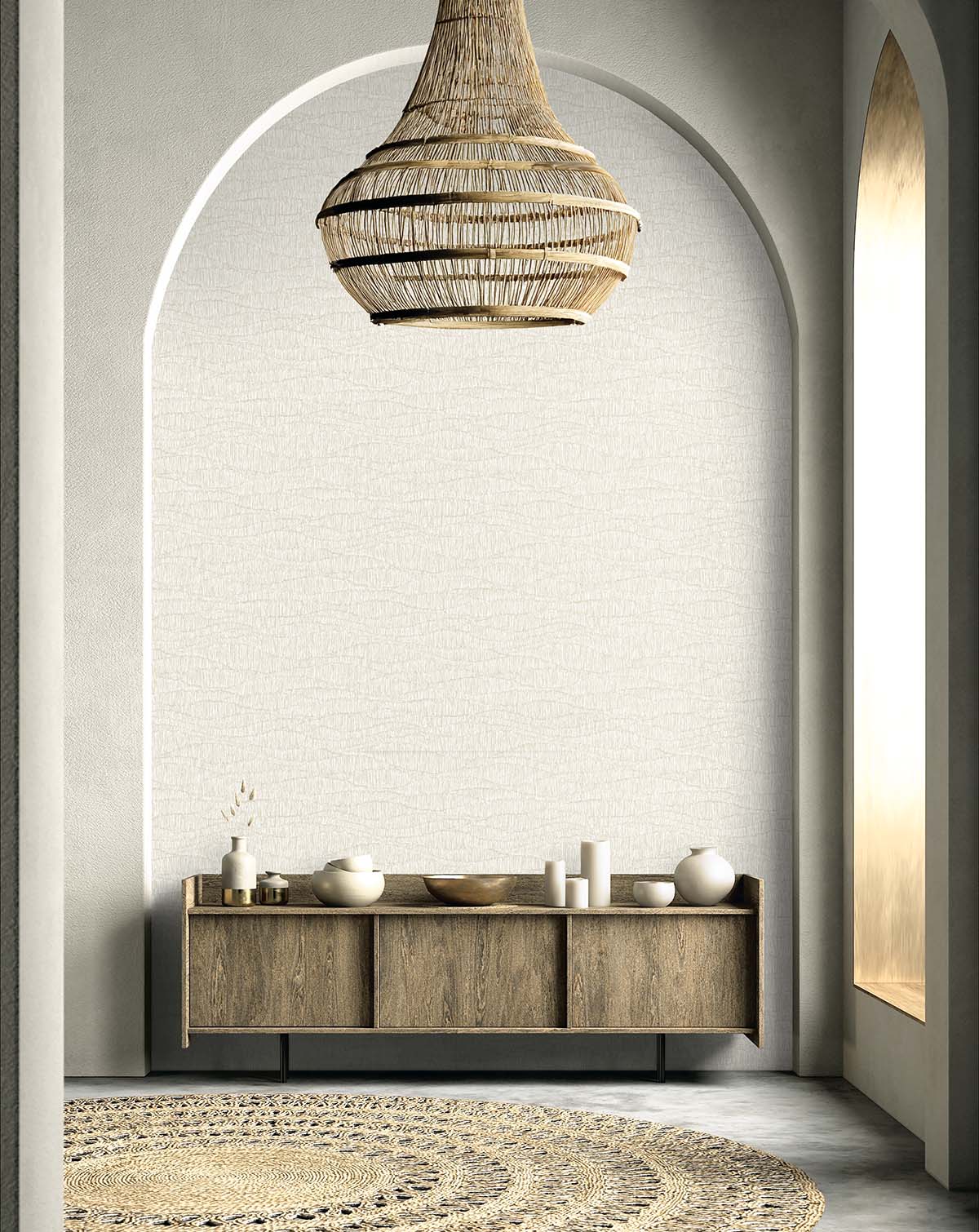 Minimalist room featuring Wavy Wallpaper, a woven pendant light, arched wall, wooden console, and textured rug.