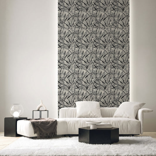 Modern living room with white sofa, black tables, and a tall wall panel featuring Brushstroke Wallpaper.
