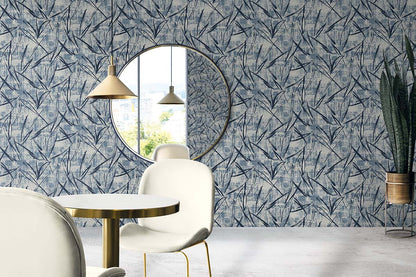 Modern dining with white chairs, round table, Brushstroke Wallpaper, and gold pendant lights.