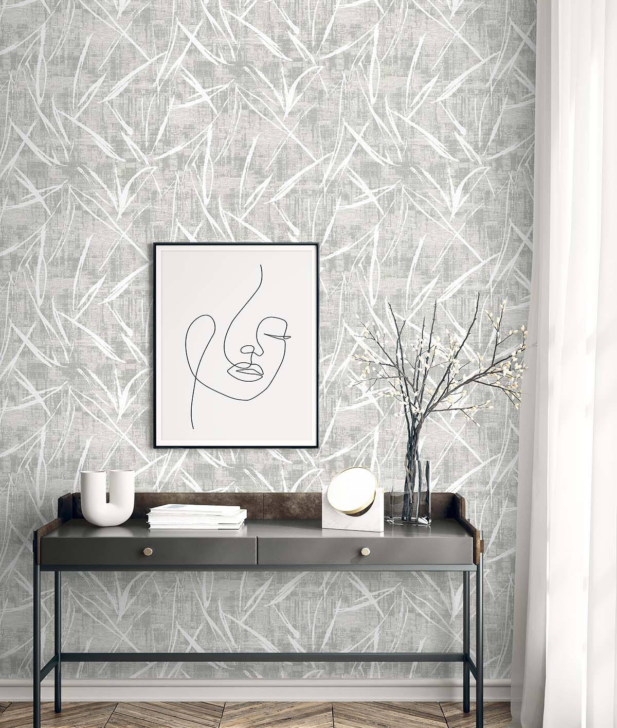 A modern console table sits against Brushstroke Wallpaper, with minimal line art decor hanging above.
