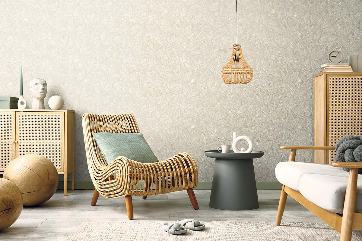 Modern living room with wicker furniture, rattan lamp, Fan Wallpaper, neutral tones, and minimalistic decor.