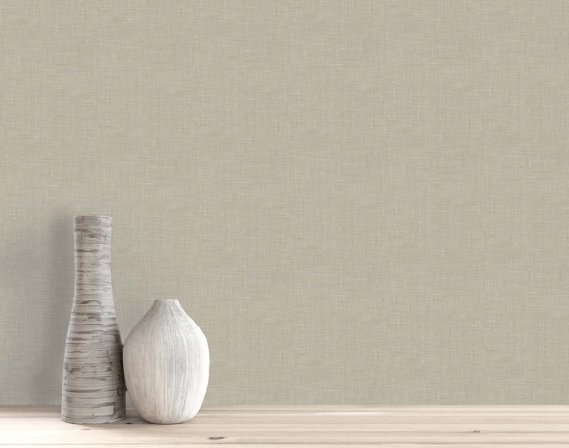 Two decorative vases rest on a wooden surface, set against a beige wall with elegant Faux Linen Wallpaper.