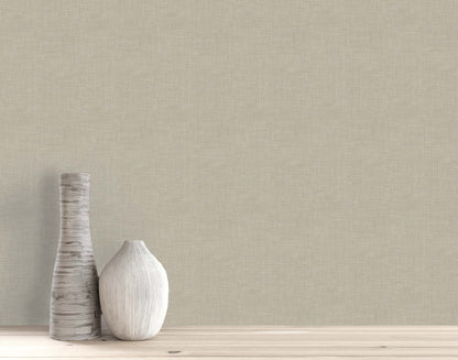 Two decorative vases rest on a wooden surface, set against a beige wall with elegant Faux Linen Wallpaper.
