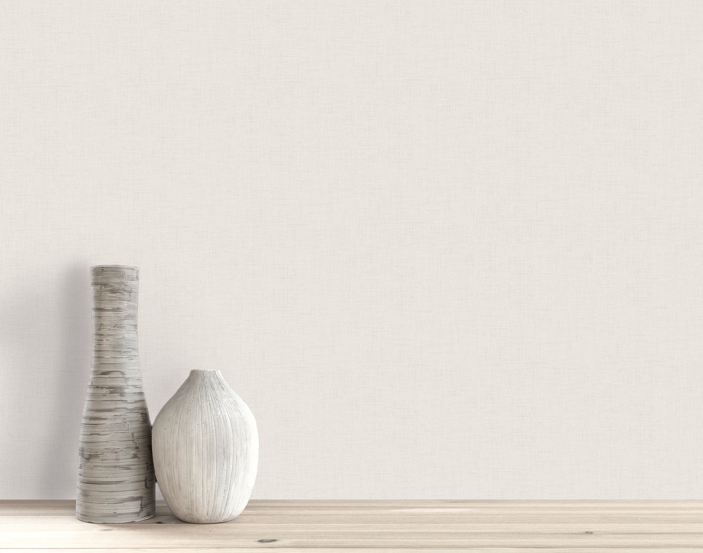 Two decorative vases on a wooden surface stand out against a plain wall with Faux Linen Wallpaper.