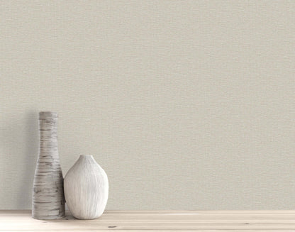 Two decorative vases on a light wooden surface with Pearly Linen Wallpaper in a plain beige textured finish.