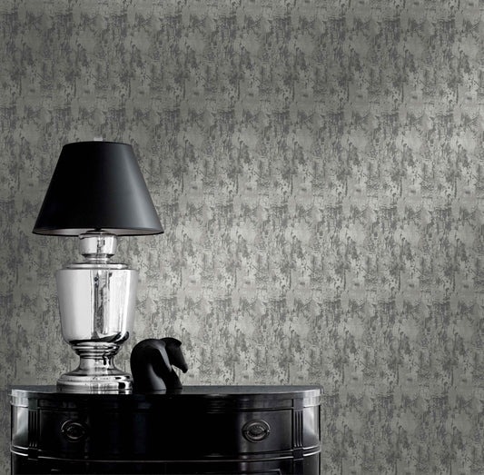 Silver lamp with black shade on glossy table beside sculpture against Faux Concrete Wallpaper.