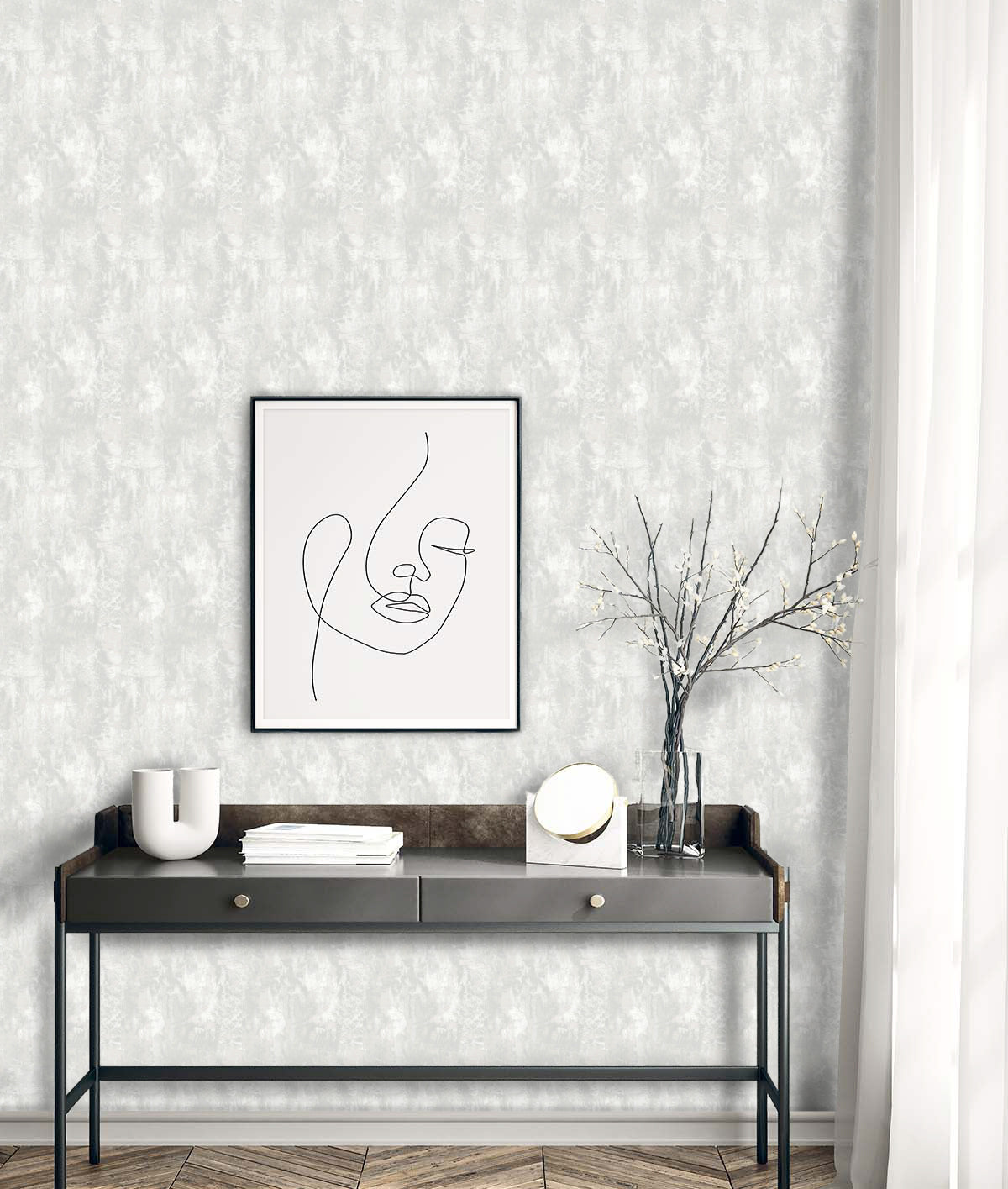 Faux Concrete Wallpaper featured above a sleek black console with decorative objects and books.
