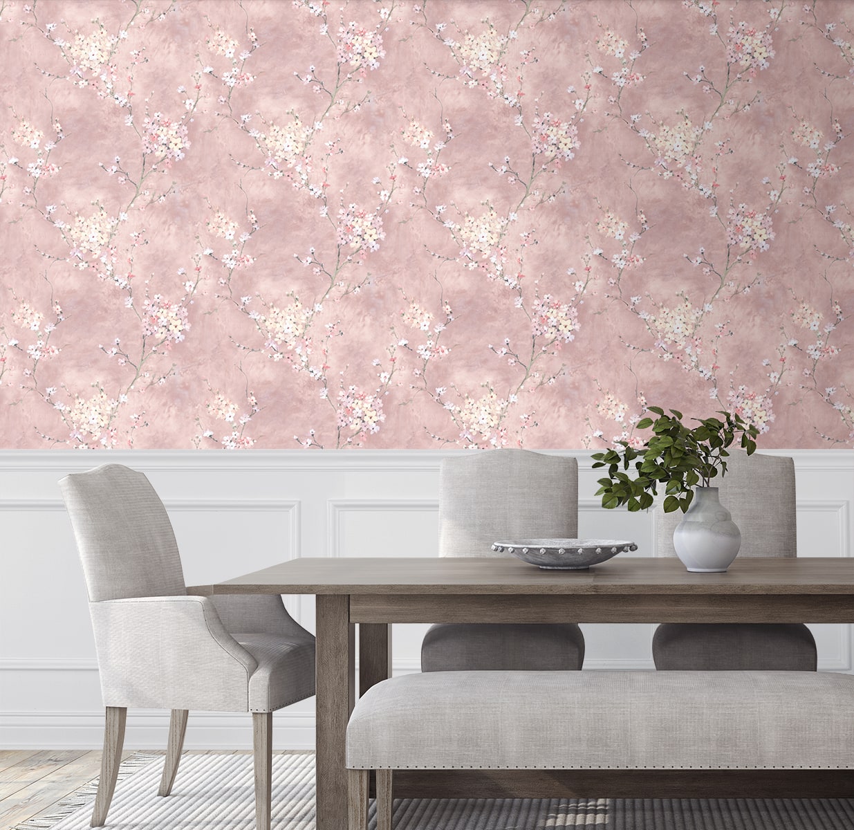 Dining room with wall decorated with Pink Blossom Branch Peel & Stick Casa Mia Wallcovering, wooden table, and gray chairs.
