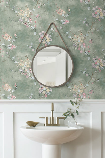 Round mirror with Green Blossom Branch Peel & Stick Casa Mia Wallcovering in a bathroom setting.
