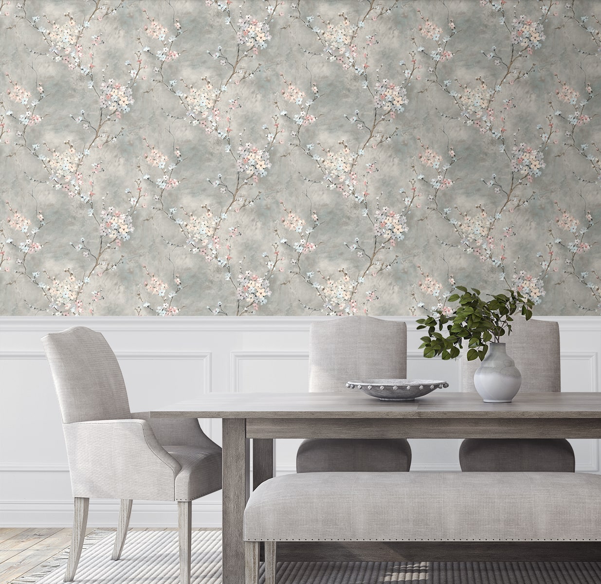 Dining room with wall decorated with Gray Blossom Branch Peel & Stick Casa Mia Wallcovering, wooden table, and gray chairs.