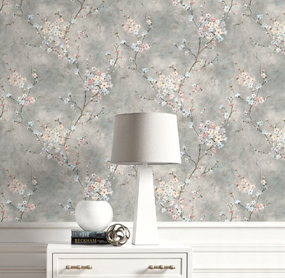 Lamp on a white dresser with Gray Blossom Branch Peel & Stick Casa Mia Wallcovering on the background.