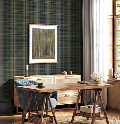 Home office with wooden desk, and framed artwork against a wall decorated with Blue Tailored Plaid Peel & Stick Casa Mia Wallcovering.