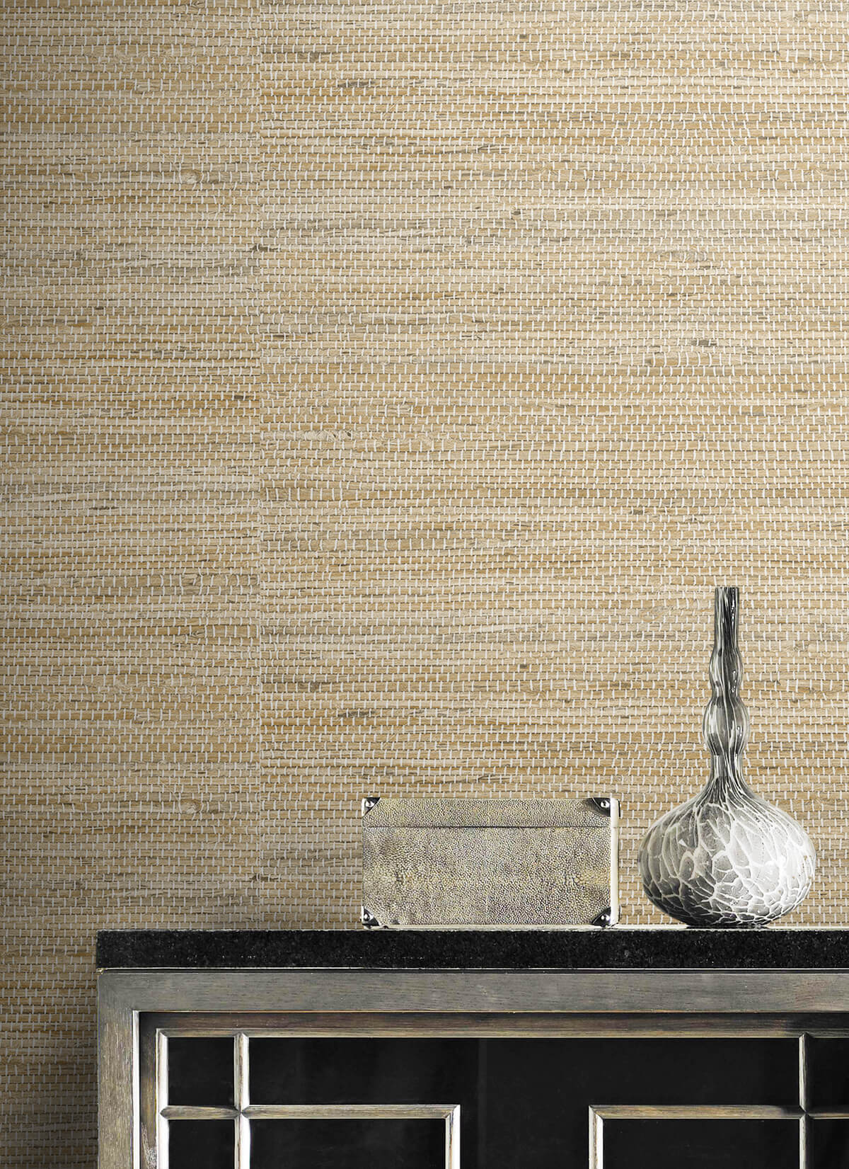 Textured wall decorated Beige Weave Grasscloth Effect Peel & Stick Casa Mia Wallcovering with a decorative vase and glass bowl on a dark surface.