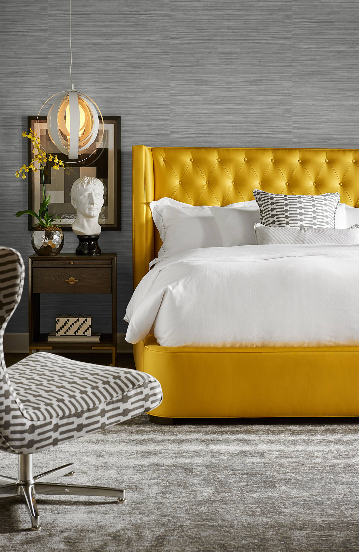 Modern bedroom with a yellow upholstered bed and wall decorated with Gray Faux Sisal Peel & Stick Casa Mia Wallcovering.