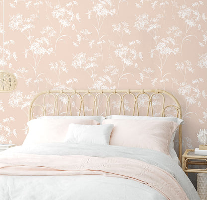 Bedroom wall decorated with Pink Soft Scent Floral Peel & Stick Casa Mia Wallcovering   and a bed with white bedding.