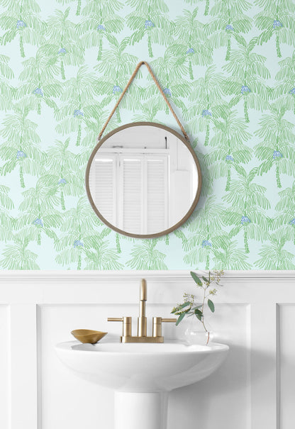 Bathroom with round mirror hanging on a Green Palm Peel & Stick Casa Mia Wallcovering.
