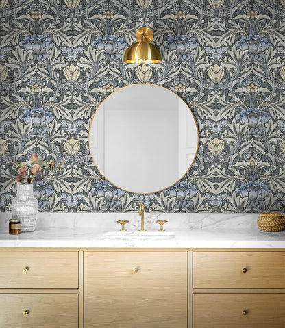 Bathroom with decorated with Black & Blue Bear's Breeches Peel & Stick Casa Mia Wallcovering, gold accents, and wooden vanity.