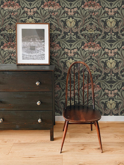Wooden chair in front of a dresser with wall decorated with Black & Rose Bear's Breeches Peel & Stick Casa Mia Wallcovering.
