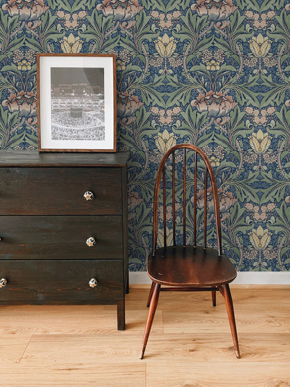 Wooden chair in front of a dresser and wall decorated with Blue & Red Bear's Breeches Peel & Stick Casa Mia Wallcovering.