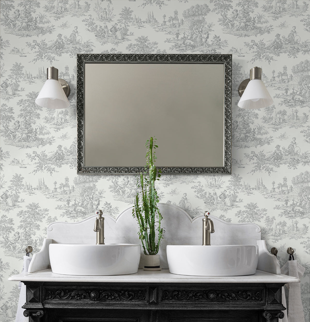 Bathroom vanity with two sinks, a mirror, and decorative wall lights against a wall decorated with Gray Toile de Jouy Peel & Stick Casa Mia Wallcovering.