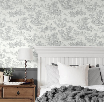 Bedroom wall decorated Gray Toile de Jouy Peel & Stick Casa Mia Wallcovering, wooden nightstand, and bed with gray and white bedding.