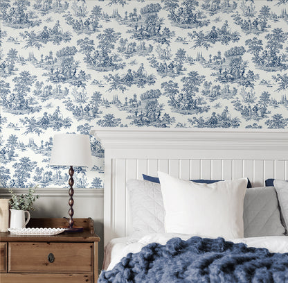 Bedroom wall decorated with Blue Toile de Jouy Peel & Stick Casa Mia Wallcovering, wooden nightstand, and bed with pillows and blanket.