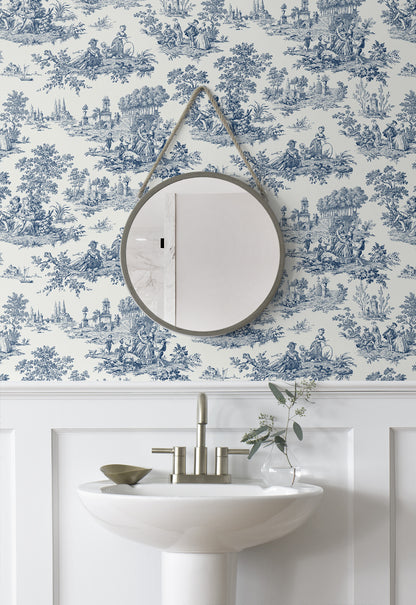 Round mirror on a wall decorated with Blue Toile de Jouy Peel & Stick Casa Mia Wallcovering above a sink.