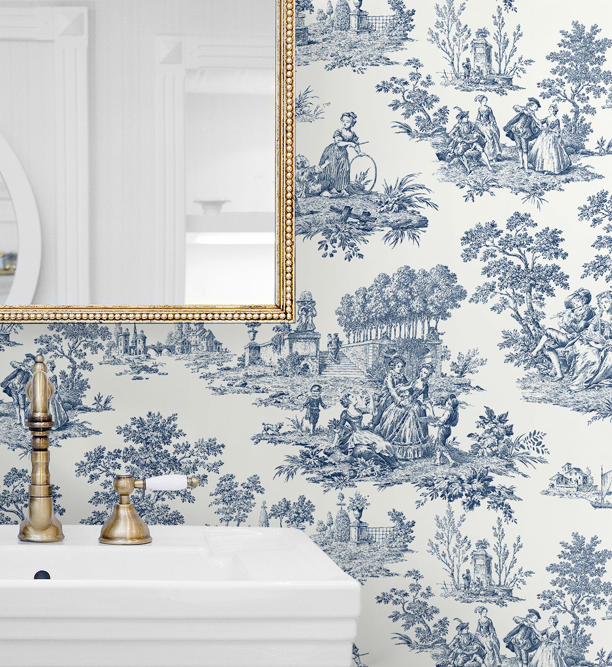 Wallpaper with blue and white toile design featuring people and nature Blue Toile de Jouy Peel & Stick Casa Mia Wallcovering, with a gold-framed mirror.