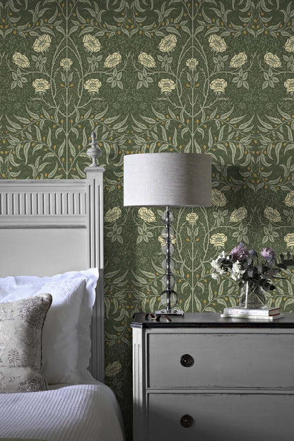 Bedroom with wall decorated Green Drawn Floral Peel & Stick Casa Mia Wallcovering, gray nightstand, and white lamp.