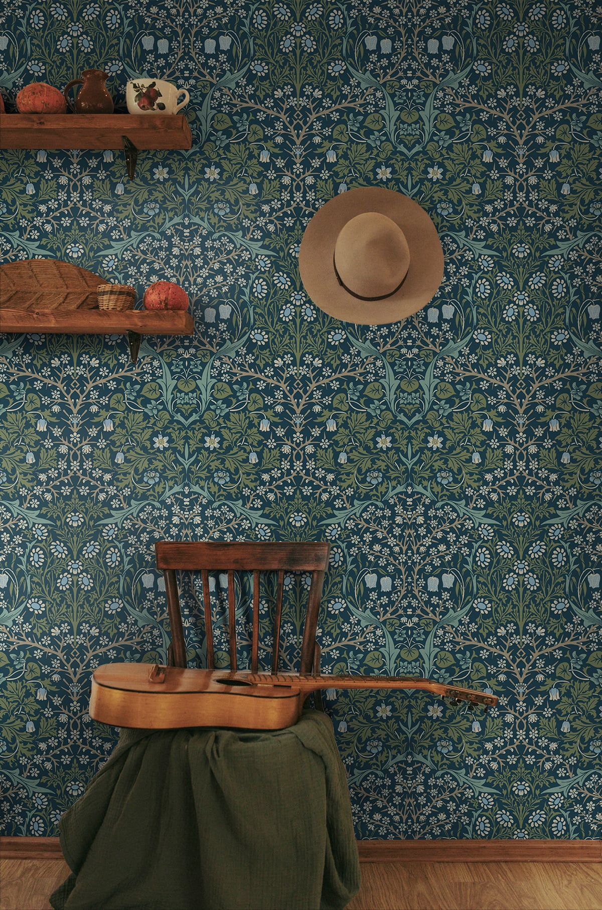 Room interior with wall decorated with Blue & Green Victorian Floral Peel & Stick Casa Mia Wallcovering, wooden chair, guitar, and hat.