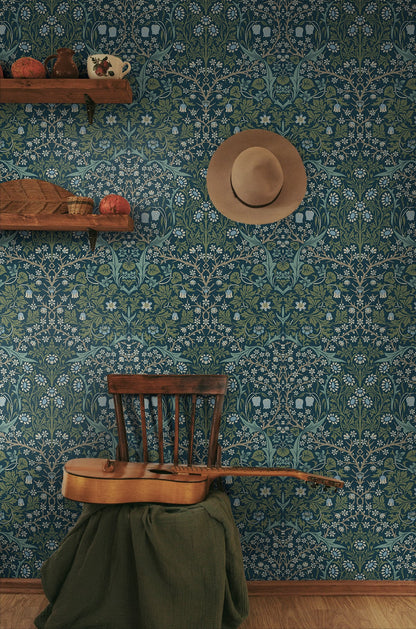 Room interior with wall decorated with Blue & Green Victorian Floral Peel & Stick Casa Mia Wallcovering, wooden chair, guitar, and hat.