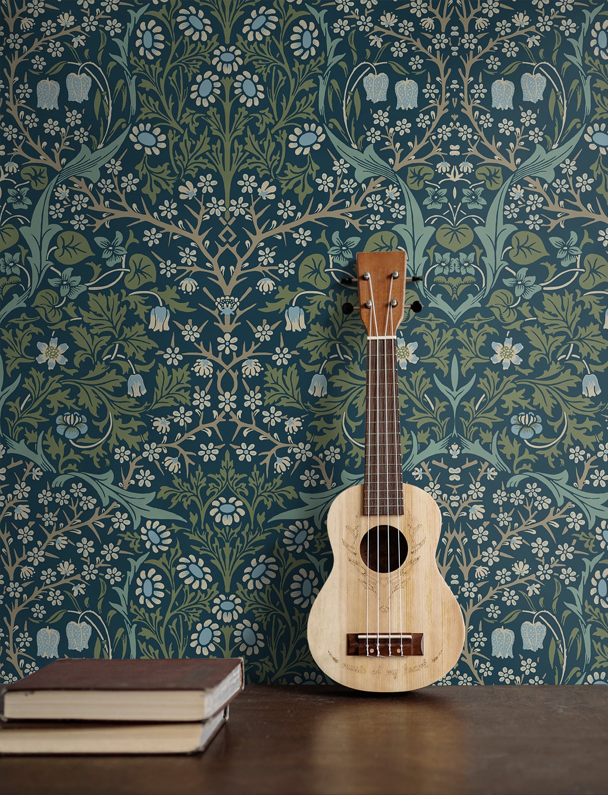 Wooden ukulele leaning against a wall decorated with Blue & Green Victorian Floral Peel & Stick Casa Mia Wallcovering.
