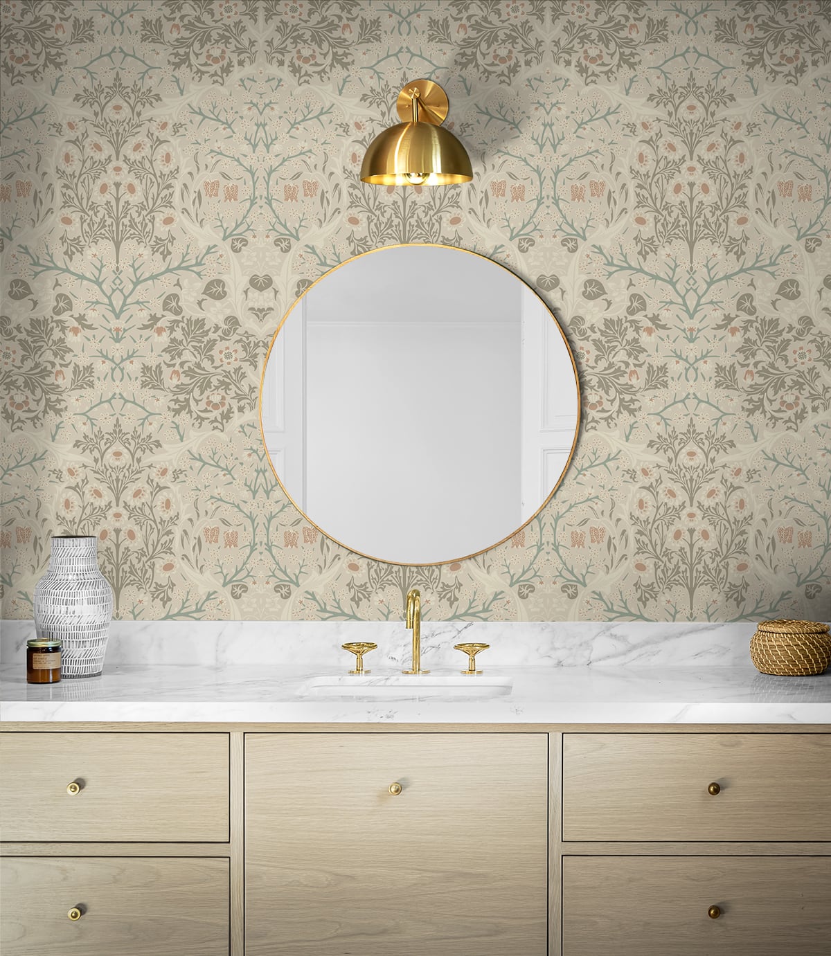 Bathroom with round mirror, gold fixtures, and wall decorated with Beige Victorian Floral Peel & Stick Casa Mia Wallcovering.