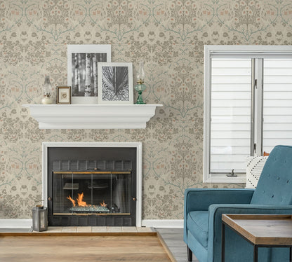 Living room with a fireplace, teal sofa, and decorative elements against a wall decorated with Beige Victorian Floral Peel & Stick Casa Mia Wallcovering.