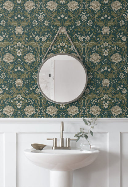 Round mirror on a wall decorated with Teal Woodbine Trail Peel & Stick Casa Mia Wallcovering and a sink below.