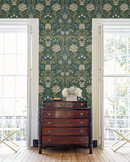 Floral wallpapered room with Teal Woodbine Trail Peel & Stick
Casa Mia Wallcovering and a wooden dresser and decorative elements.