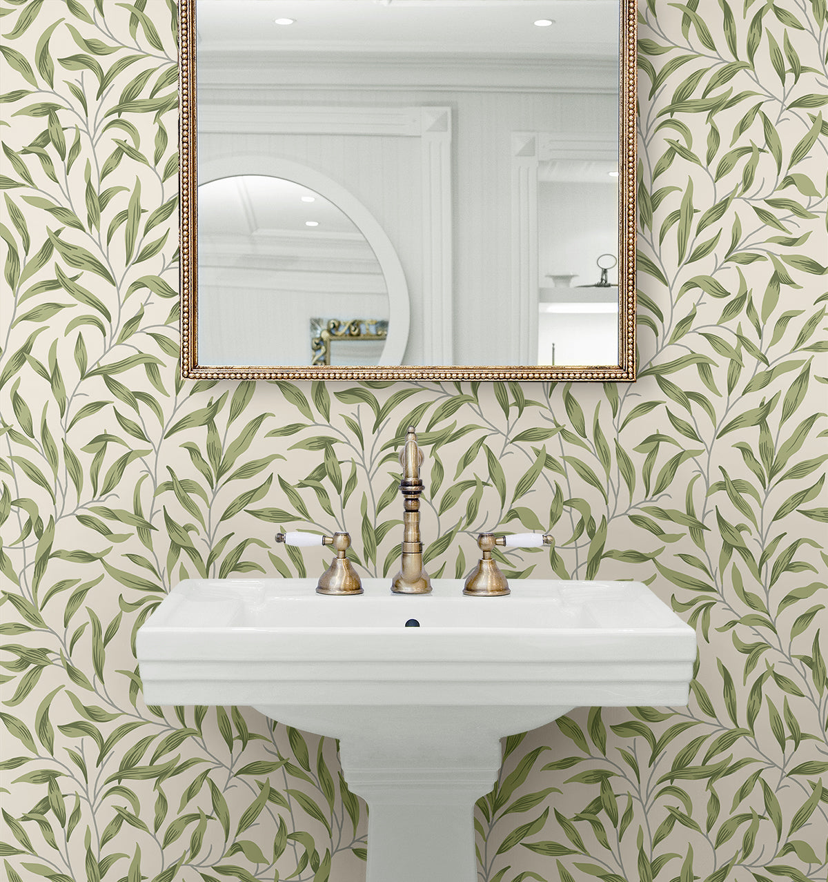Bathroom with wall decorated Green Leafy Branches Peel & Stick Casa Mia Wallcovering patterned wallpaper, white sink, and gold-framed mirror.