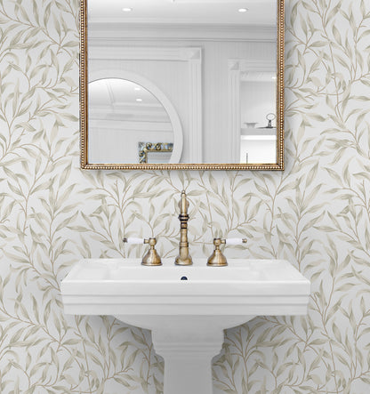 Bathroom with a sink, gold fixtures, and Beige Leafy Branches Peel & Stick Casa Mia Wallcovering.