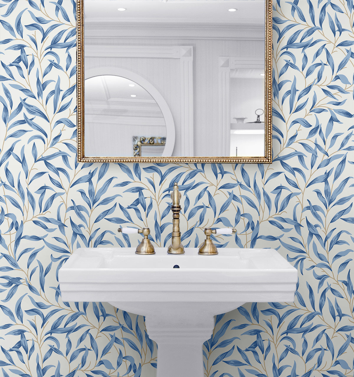 Bathroom wall decorated with Blue Leafy Branches Peel & Stick Casa Mia Wallcovering, white sink, and gold fixtures.
