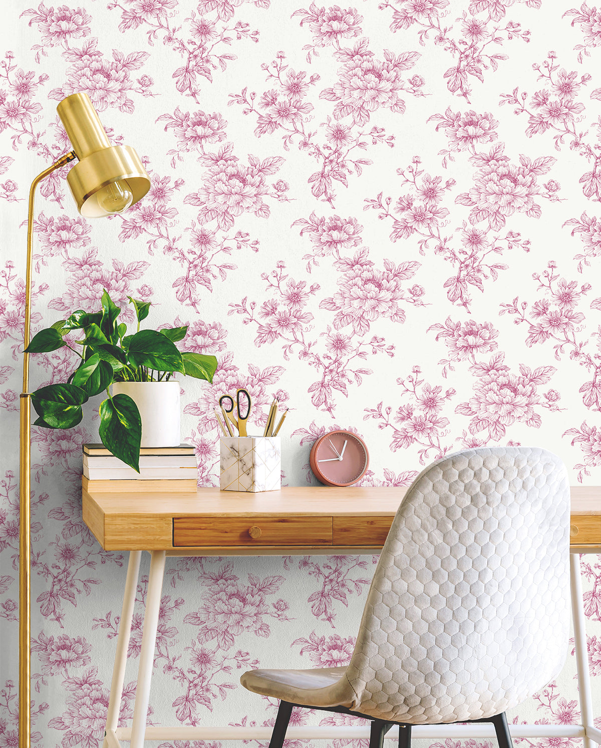 Home office wall decorated with, Pink Cherished Rose Peel & Stick Casa Mia Wallcovering wooden desk, white chair, and gold lamp.