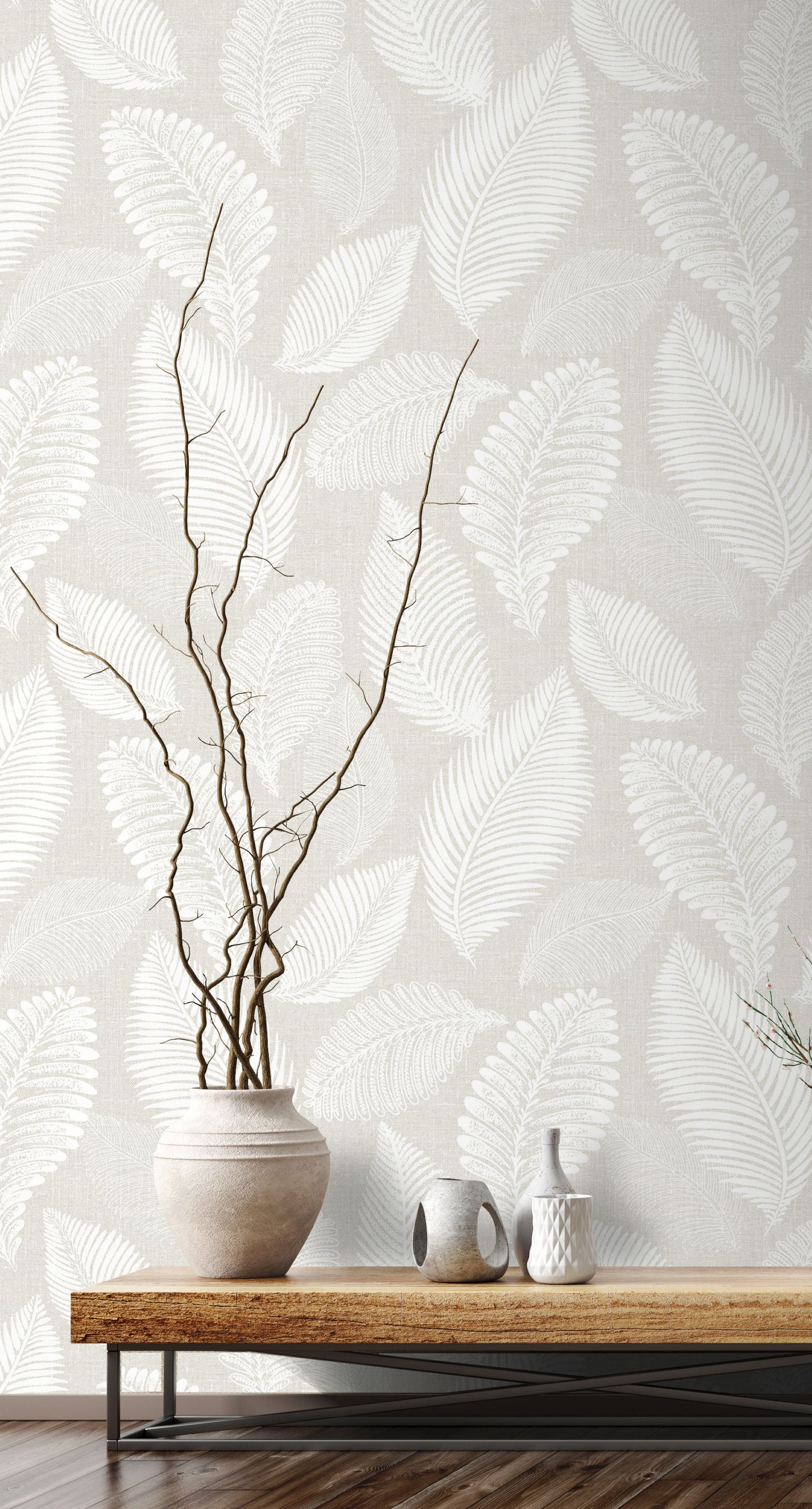 White/Off White Scattered Leaves Wallpaper with a wooden table and decorative items.