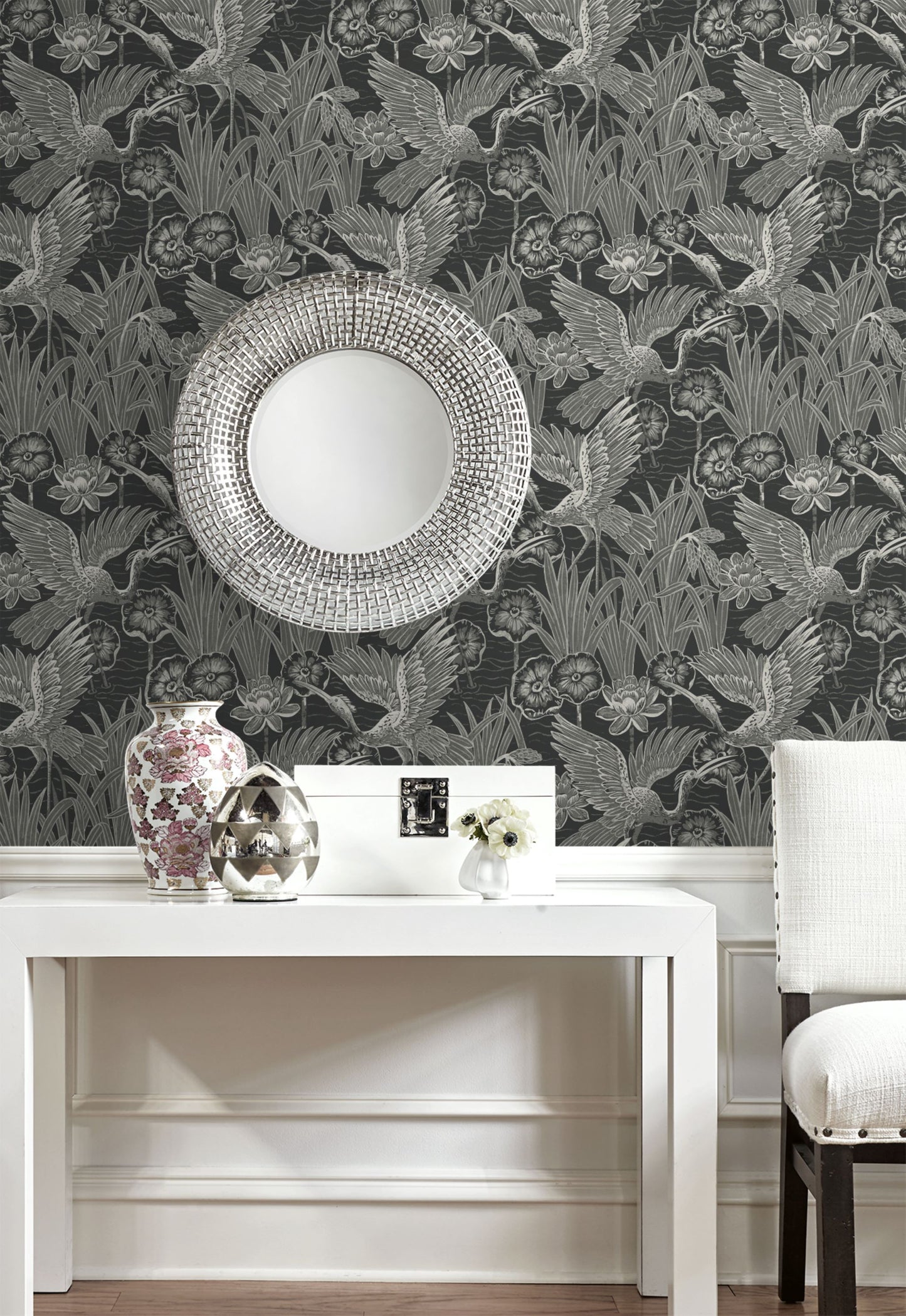 Decorative room with wall decorated with Black Marsh Heron Wallpaper, white table, and vase.