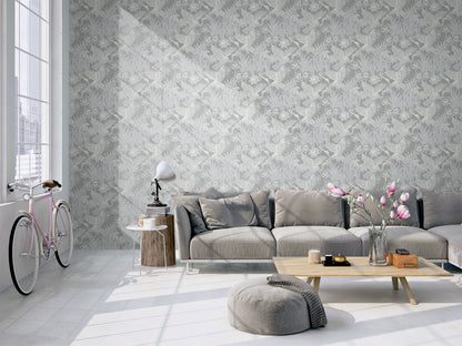 Modern living room with a gray sectional sofa, coffee table, and decorative elements against a wall decorated with Gray Marsh Heron Wallpaper.
