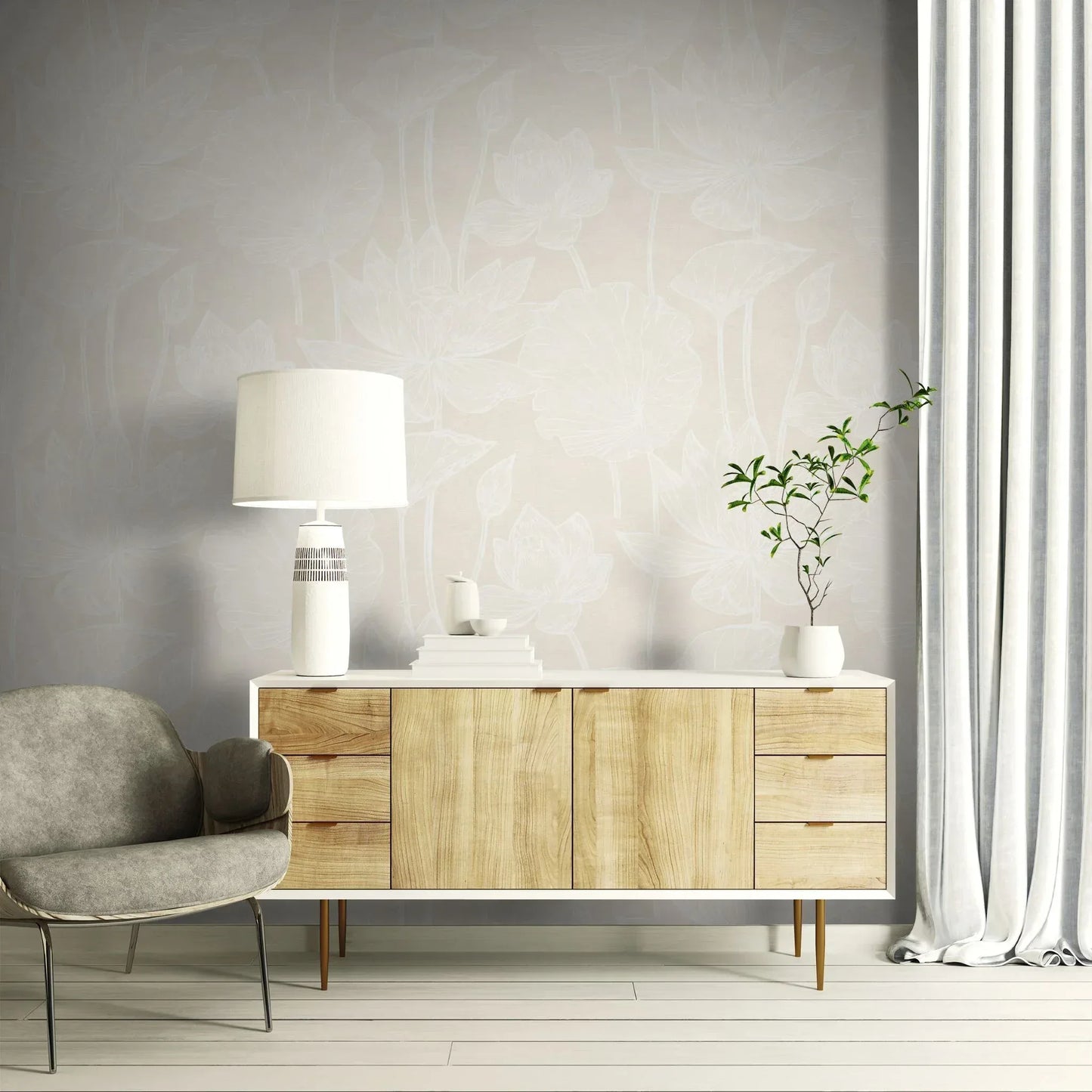 Modern living room with a wooden sideboard, gray chair, and Lily Flower Wallpaper behind a lamp and potted plant.