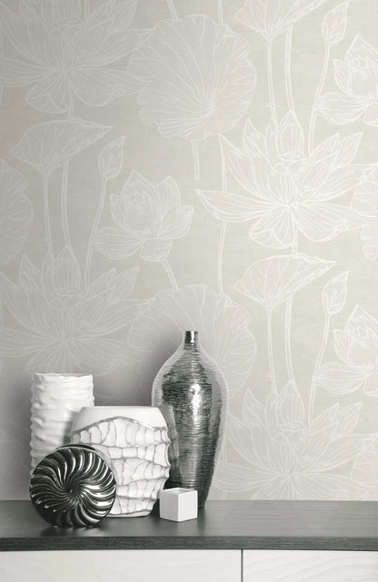Vases and decor objects on a shelf against beige-toned Lily Flower Wallpaper.